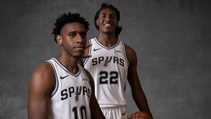 June 25, 2026; San Antonio, Texas, USA; San Antonio Spurs center Tarris Reed Jr. (10) and center Jayden Quaintance (22) pose for photos in their new jerseys at Victory Capital Performance Center. 