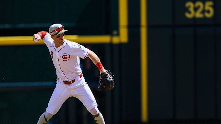 May 18, 2025; Cincinnati, Ohio, USA; Cincinnati Reds second baseman Matt McLain (9) throws to first to get Cleveland Guardians second baseman Daniel Schneemann (not pictured) out in the sixth inning at Great American Ball Park. Mandatory Credit: Katie Stratman-Imagn Images