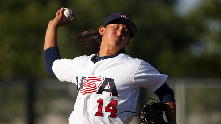 Jul 22, 2015; Toronto, Ontario, CAN; United States starting pitcher Kelsie Whitmore (14) delivers a pitch in the first inning against Cuba during the 2015 Pan Am Games at Ajax Pan Am Ballpark. USA beat Cuba 11-0. 