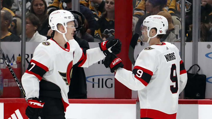 Oct 28, 2023; Pittsburgh, Pennsylvania, USA; Ottawa Senators left wing Brady Tkachuk (7) is congratulated by center Josh Norris (9) after Tkachuk scored a goal against the Pittsburgh Penguins during the first period at PPG Paints Arena. Mandatory Credit: Charles LeClaire-Imagn Images