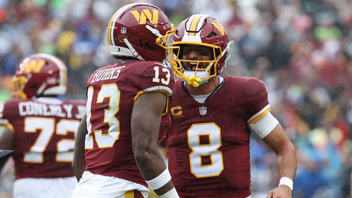 Sep 27, 2026; Landover, Maryland, USA; Washington Commanders quarterback Marcus Mariota (8) reacts with wide receiver Treylon Burks (13) in the first half at Northwest Stadium. Mandatory Credit: Geoff Burke-Imagn Images Sep 27, 2026; Landover, Maryland, USA; Washington Commanders quarterback Marcus Mariota (8) reacts with wide receiver Treylon Burks (13) in the first half at Northwest Stadium. Mandatory Credit: Geoff Burke-Imagn Images