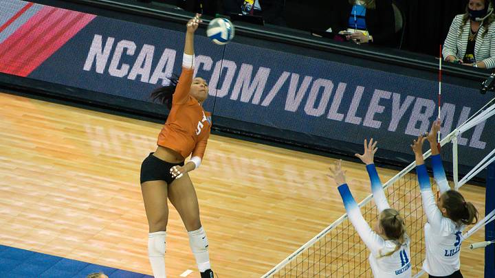 Apr 24, 2021; Omaha, Nebraska, USA; Texas Longhorns outside hitter Skylar Fields (5) attacks against Kentucky Wildcats middle blocker Elise Goetzinger (11) and libero Lauren Tharp (5) in the first set at CHI Health Center Arena and Convention Center. Mandatory Credit: Steven Branscombe-USA TODAY Sports Apr 24, 2021; Omaha, Nebraska, USA; Texas Longhorns outside hitter Skylar Fields (5) attacks against Kentucky Wildcats middle blocker Elise Goetzinger (11) and libero Lauren Tharp (5) in the first set at CHI Health Center Arena and Convention Center. Mandatory Credit: Steven Branscombe-USA TODAY Sports