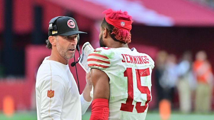 Jan 5, 2025; Glendale, Arizona, USA; San Francisco 49ers wide receiver Jauan Jennings (15) talks with head coach Kyle Shanahan after being ejected in the first half against the Arizona Cardinals at State Farm Stadium. Mandatory Credit: Matt Kartozian-Imagn Images