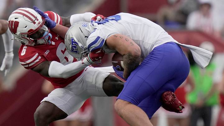 Wisconsin cornerback Omillio Agard (6) tackles Middle Tennessee tight end Hunter Tipton (82) during the third quarter of the game Saturday, September 6, 2025 at Camp Randall Stadium in Madison, Wisconsin.