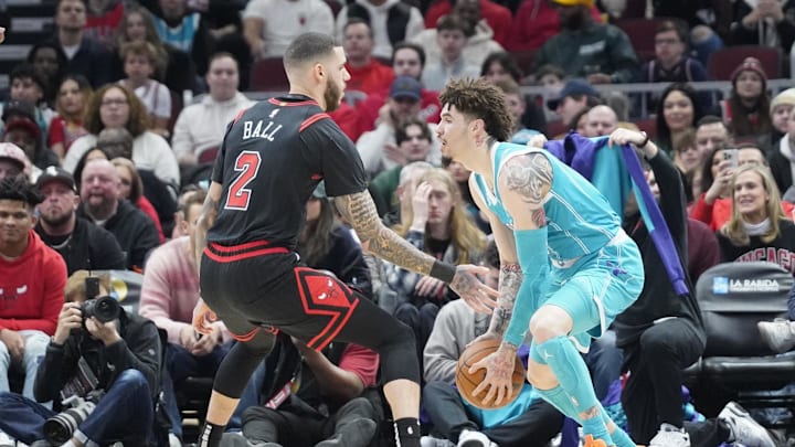 Jan 17, 2025; Chicago, Illinois, USA; Chicago Bulls guard Lonzo Ball (2) defends Charlotte Hornets guard LaMelo Ball (1) during the first quarter at United Center. Mandatory Credit: David Banks-Imagn Images