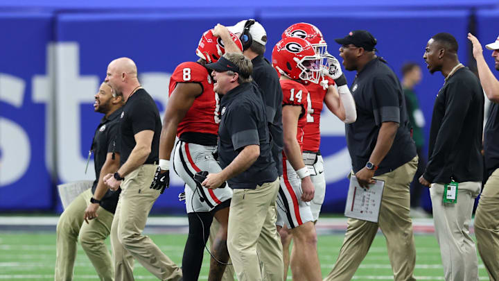 Jan 1, 2026; New Orleans, LA, USA; Georgia Bulldogs head coach Kirby Smart celebrates after a play against the Mississippi Rebels in the first half during the 2026 Sugar Bowl and quarterfinal game of the College Football Playoff at Caesars Superdome. Mandatory Credit: Stephen Lew-Imagn Images Jan 1, 2026; New Orleans, LA, USA; Georgia Bulldogs head coach Kirby Smart celebrates after a play against the Mississippi Rebels in the first half during the 2026 Sugar Bowl and quarterfinal game of the College Football Playoff at Caesars Superdome. Mandatory Credit: Stephen Lew-Imagn Images