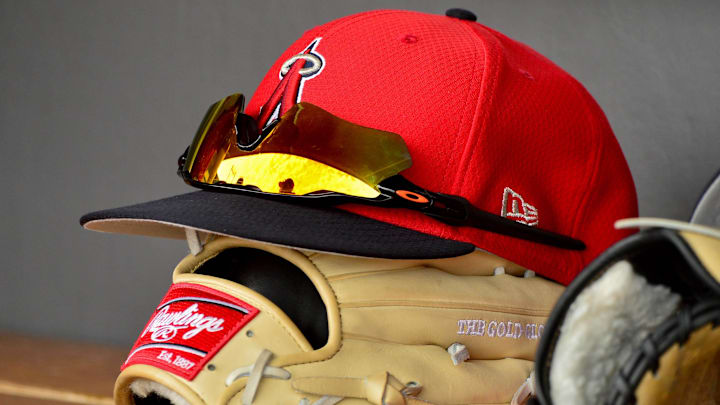 Mar 6, 2019; Salt River Pima-Maricopa, AZ, USA; General view of a Los Angeles Angels hat, glasses, and glove during the game against the Colorado Rockies at Salt River Fields at Talking Stick. Mandatory Credit: Matt Kartozian-Imagn Images Mar 6, 2019; Salt River Pima-Maricopa, AZ, USA; General view of a Los Angeles Angels hat, glasses, and glove during the game against the Colorado Rockies at Salt River Fields at Talking Stick. Mandatory Credit: Matt Kartozian-Imagn Images