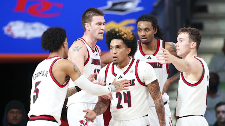 Nov 28, 2024; Paradise Island, Bahamas, BHS; Louisville Cardinals guard Chucky Hepburn (24) celebrates with teammates during the second half against the West Virginia Mountaineers at Imperial Arena at the Atlantis resort. Nov 28, 2024; Paradise Island, Bahamas, BHS; Louisville Cardinals guard Chucky Hepburn (24) celebrates with teammates during the second half against the West Virginia Mountaineers at Imperial Arena at the Atlantis resort.