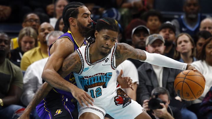 Nov 6, 2024; Memphis, Tennessee, USA; Memphis Grizzlies guard Ja Morant (12) drives to the basket as Los Angeles Lakers guard Gabe Vincent (7) defends during the first half at FedExForum. Mandatory Credit: Petre Thomas-Imagn Images Nov 6, 2024; Memphis, Tennessee, USA; Memphis Grizzlies guard Ja Morant (12) drives to the basket as Los Angeles Lakers guard Gabe Vincent (7) defends during the first half at FedExForum. Mandatory Credit: Petre Thomas-Imagn Images