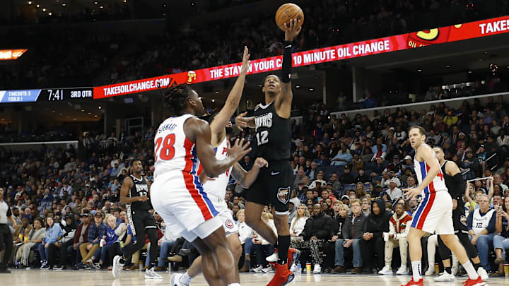Dec 9, 2022; Memphis, Tennessee, USA; Memphis Grizzlies guard Ja Morant (12) drives to the basket against the Detroit Pistons during the second half at FedExForum. Mandatory Credit: Petre Thomas-Imagn Images