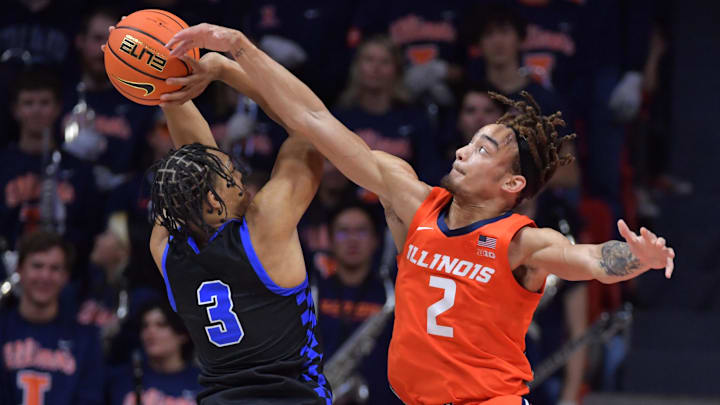Nov 4, 2024; Champaign, Illinois, USA; Illinois Fighting Illini guard Dra Gibbs-Lawhorn (2) tries to block the shot of Eastern Illinois Panthers guard Nakyel Shelton (3) during the first half at State Farm Center. Mandatory Credit: Ron Johnson-Imagn Images Nov 4, 2024; Champaign, Illinois, USA; Illinois Fighting Illini guard Dra Gibbs-Lawhorn (2) tries to block the shot of Eastern Illinois Panthers guard Nakyel Shelton (3) during the first half at State Farm Center. Mandatory Credit: Ron Johnson-Imagn Images