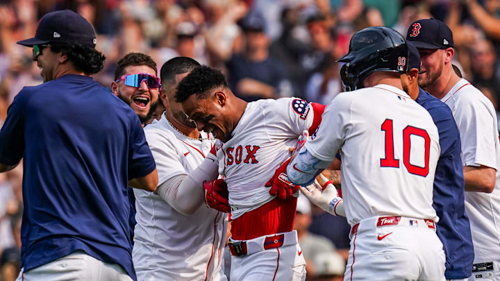 Jun 4, 2025; Boston, Massachusetts, USA; Boston Red Sox outfielder Ceddanne Rafaela (3) is congratulated after hitting a game winning home run against the Los Angeles Angels in the ninth inning at Fenway Park. 