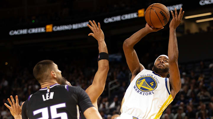 Golden State Warriors guard Moses Moody (4) shoots over Sacramento Kings center Alex Len (25) during the third quarter at Chase Center. Mandatory Credit: D. Ross Cameron-Imagn Images