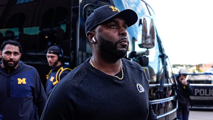 Michigan head coach Sherrone Moore walks towards the locker room 
