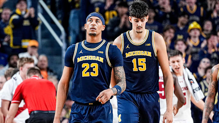 Michigan forward Yaxel Lendeborg (23) and center Aday Mara (15) walk off the court at a timeout against Wisconsin during the second half at Crisler Center in Ann Arbor on Saturday, Jan. 10, 2026.