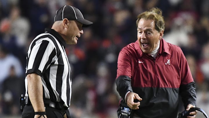 Nov 25, 2023; Auburn, Alabama, USA;  Alabama Crimson Tide head coach Nick Saban protests a call by the officials against Alabama during a game against the Auburn Tigers at Jordan-Hare Stadium. Alabama won 27-24. Mandatory Credit: Gary Cosby Jr.-Imagn Images