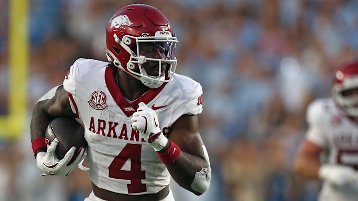 Arkansas Razorback running back Mike Washington Jr. (4) runs the ball for a score during the second quarter against the Ole Miss Rebels at Vaught-Hemingway Stadium in Oxford, Miss.