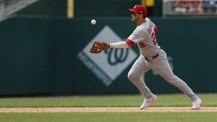 May 11, 2025; Washington, District of Columbia, USA; St. Louis Cardinals third base Nolan Arenado (28) bobbles a ground ball hit by Washington Nationals first base Nathaniel Lowe (not pictured) during the ninth inning at Nationals Park. Mandatory Credit: Geoff Burke-Imagn Images