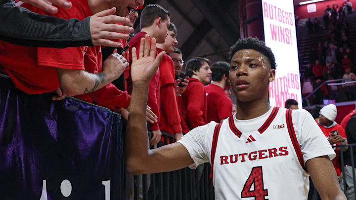 Mar 9, 2025; Piscataway, New Jersey, USA; Rutgers Scarlet Knights guard Ace Bailey (4) slap hands with fans after the game against the Minnesota Golden Gophers at Jersey Mike's Arena. Mandatory Credit: Vincent Carchietta-Imagn Images