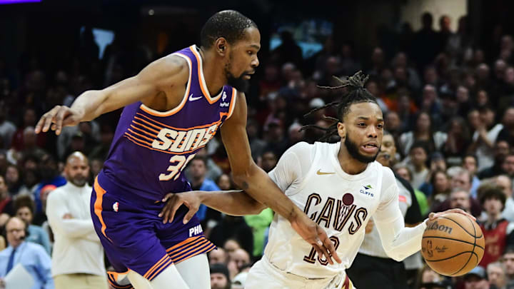 Mar 11, 2024; Cleveland, Ohio, USA; Cleveland Cavaliers guard Darius Garland (10) drives to the basket against Phoenix Suns forward Kevin Durant (35) during the second half at Rocket Mortgage FieldHouse. Mandatory Credit: Ken Blaze-Imagn Images