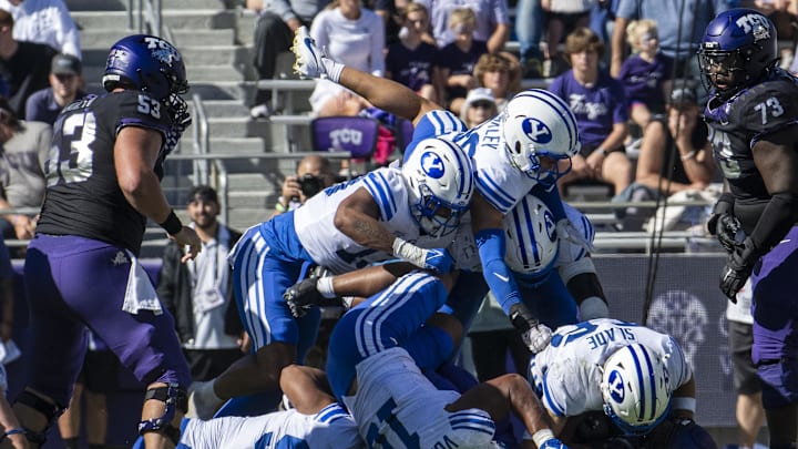Oct 14, 2023; Fort Worth, Texas, USA; TCU Horned Frogs running back Trey Sanders (2) is gang tackled by the Brigham Young Cougars defense during the game at Amon G. Carter Stadium. Mandatory Credit: Jerome Miron-Imagn Images