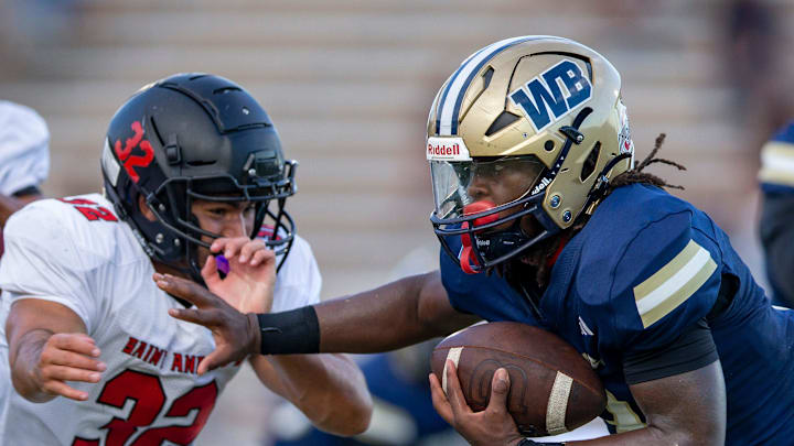 West Boca Raton Javian Mallory gains ground against St. Andrews John Boueri in West Boca Raton,