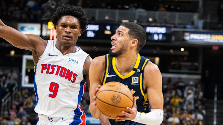 Feb 22, 2024; Indianapolis, Indiana, USA; Indiana Pacers guard Tyrese Haliburton (0) dribbles the ball while Detroit Pistons forward Ausar Thompson (9) defends in the second half at Gainbridge Fieldhouse. Mandatory Credit: Trevor Ruszkowski-Imagn Images