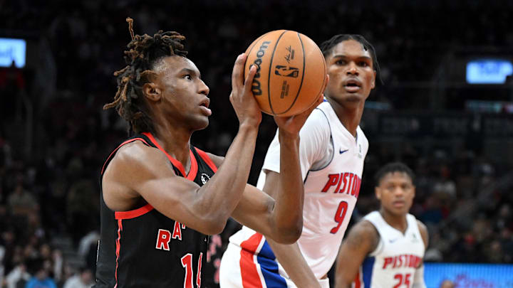 Apr 4, 2025; Toronto, Ontario, CAN;  Toronto Raptors guard Ja'Kobe Walter (14) sets up to shoot the ball as Detroit Pistons forward Ausar Thompson (9) looks on in the second half at Scotiabank Arena. Mandatory Credit: Dan Hamilton-Imagn Images