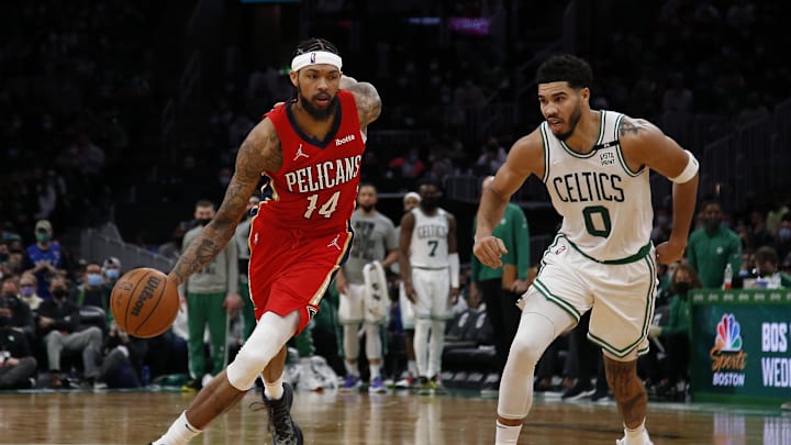 Jan 17, 2022; Boston, Massachusetts, USA; New Orleans Pelicans forward Brandon Ingram (14) dribbles past Boston Celtics forward Jayson Tatum (0) during the second half at TD Garden. Mandatory Credit: Winslow Townson-Imagn Images