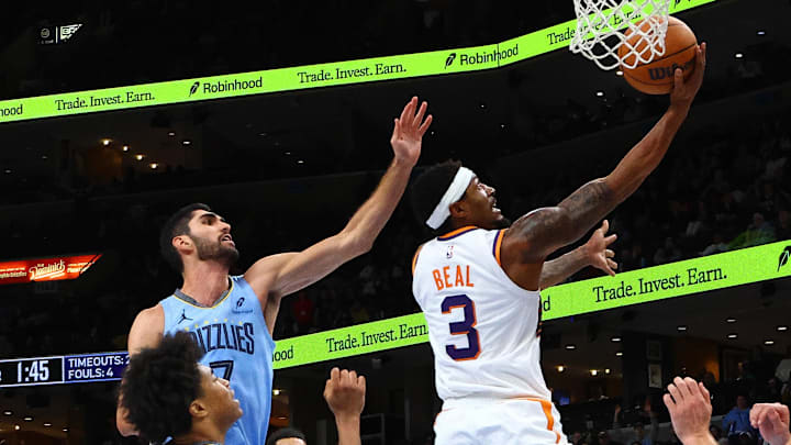 Feb 25, 2025; Memphis, Tennessee, USA; Phoenix Suns guard Bradley Beal (3) shoots as Memphis Grizzlies forward Santi Aldama (7) defends during the fourth quarter at FedExForum. Mandatory Credit: Petre Thomas-Imagn Images