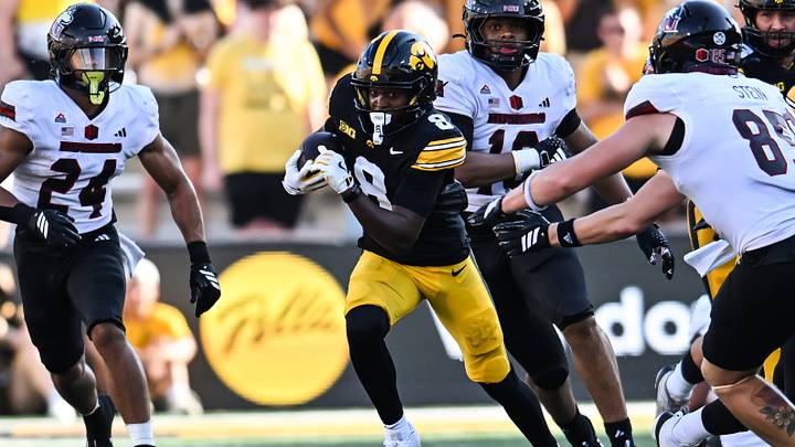 Sep 5, 2026; Iowa City, Iowa, USA; Iowa Hawkeyes wide receiver Evan James (8) runs the ball as Northern Illinois Huskies running back Elijah Porter (24) looks to pursue during the third quarter at Kinnick Stadium. Mandatory Credit: Jeffrey Becker-Imagn Images Sep 5, 2026; Iowa City, Iowa, USA; Iowa Hawkeyes wide receiver Evan James (8) runs the ball as Northern Illinois Huskies running back Elijah Porter (24) looks to pursue during the third quarter at Kinnick Stadium. Mandatory Credit: Jeffrey Becker-Imagn Images