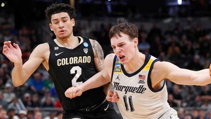 Colorado Buffaloes guard KJ Simpson (2) defends Marquette Golden Eagles guard Tyler Kolek (11) during NCAA Tournament game, Sunday, March 24, 2024, at Gainbridge Fieldhouse in Indianapolis. Colorado Buffaloes guard KJ Simpson (2) defends Marquette Golden Eagles guard Tyler Kolek (11) during NCAA Tournament game, Sunday, March 24, 2024, at Gainbridge Fieldhouse in Indianapolis.