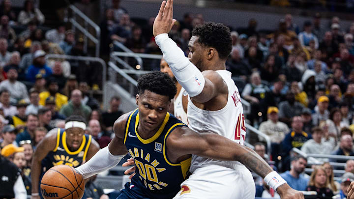 Jan 14, 2025; Indianapolis, Indiana, USA; Indiana Pacers guard Bennedict Mathurin (00) dribbles the ball while Cleveland Cavaliers guard Donovan Mitchell (45) defends in the second half at Gainbridge Fieldhouse. Mandatory Credit: Trevor Ruszkowski-Imagn Images Jan 14, 2025; Indianapolis, Indiana, USA; Indiana Pacers guard Bennedict Mathurin (00) dribbles the ball while Cleveland Cavaliers guard Donovan Mitchell (45) defends in the second half at Gainbridge Fieldhouse. Mandatory Credit: Trevor Ruszkowski-Imagn Images
