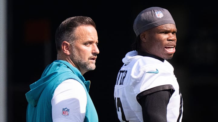 Jacksonville Jaguars Defensive Coordinator Anthony Campanile, left, walks off the field with Jacksonville Jaguars wide receiver Travis Hunter (12) after the Jacksonville Jaguars’ 18th and final training camp practice at Miller Electric Center in Jacksonville, Fla. Wednesday August 20, 2025. [Doug Engle/Florida Times-Union]