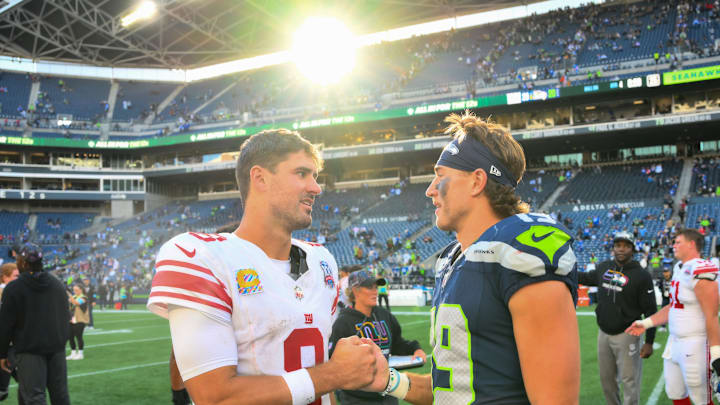 Oct 6, 2024; Seattle, Washington, USA; New York Giants quarterback Daniel Jones (8) and Seattle Seahawks wide receiver Jake Bobo (19) shake hands after the game at Lumen Field. 