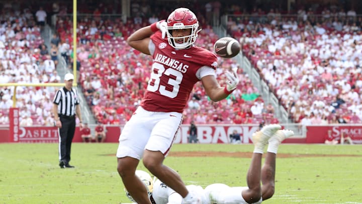 Sep 27, 2025; Fayetteville, Arkansas, USA; Arkansas Razorbacks tight end Jaden Platt (83) bobbles the football in the third quarter against the Notre Dame Fighting Irish at Donald W. Reynolds Razorback Stadium. Notre Dame won 56-13. Mandatory Credit: Nelson Chenault-Imagn Images