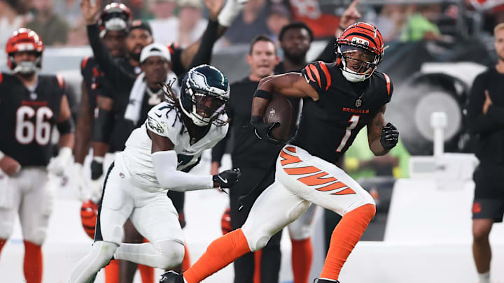Aug 7, 2025; Philadelphia, Pennsylvania, USA; Cincinnati Bengals wide receiver Ja'Marr Chase (1) runs for a touchdown past Philadelphia Eagles cornerback Kelee Ringo (7) after a catch during the first quarter at Lincoln Financial Field. 