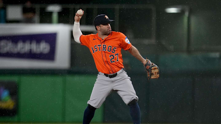 Houston Astros second baseman Jose Altuve throws the ball. Houston Astros second baseman Jose Altuve throws the ball.