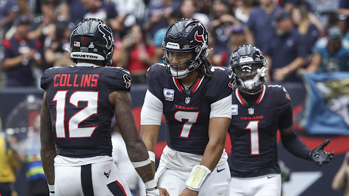 Sep 29, 2024; Houston, Texas, USA; Houston Texans quarterback C.J. Stroud (7) and wide receiver Nico Collins (12) celebrate after a touchdown by wide receiver Stefon Diggs (1) during the first quarter against the Jacksonville Jaguars at NRG Stadium. Mandatory Credit: Troy Taormina-Imagn Images