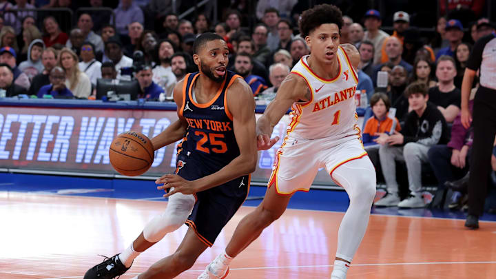 Dec 11, 2024; New York, New York, USA; New York Knicks forward Mikal Bridges (25) drives to the basket against Atlanta Hawks forward Jalen Johnson (1) during the fourth quarter at Madison Square Garden. Mandatory Credit: Brad Penner-Imagn Images Dec 11, 2024; New York, New York, USA; New York Knicks forward Mikal Bridges (25) drives to the basket against Atlanta Hawks forward Jalen Johnson (1) during the fourth quarter at Madison Square Garden. Mandatory Credit: Brad Penner-Imagn Images