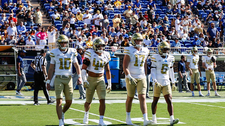 Oct 18, 2025; Durham, North Carolina, USA; Georgia Tech Yellow Jackets quarterback Haynes King (10), linebacker Kyle Efford (44), tight end Josh Beetham (17), and  wide receiver Debron Gatling (6) walk out for the coin toss  before the first half of the game against Duke Blue Devils at Wallace Wade Stadium. Mandatory Credit: Jaylynn Nash-Imagn Images