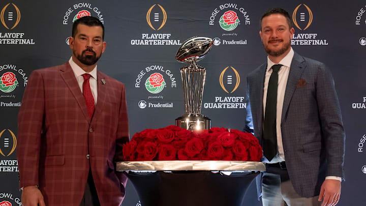 Oregon head coach Dan Lanning, right, and Ohio State head coach Ryan Day pose for a photo.