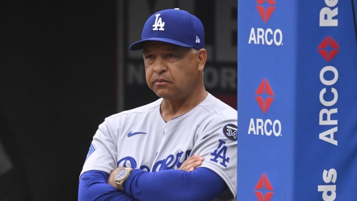 May 27, 2025; Cleveland, Ohio, USA; Los Angeles Dodgers manager Dave Roberts (30) stands in the dugout in the third inning against the Cleveland Guardians at Progressive Field. Mandatory Credit: David Richard-Imagn Images