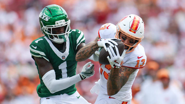 Sep 21, 2025; Tampa, Florida, USA; Tampa Bay Buccaneers wide receiver Mike Evans (13) catches pass defended boy New York Jets cornerback Sauce Gardner (1) in the third quarter at Raymond James Stadium. Mandatory Credit: Nathan Ray Seebeck-Imagn Images