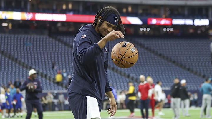 Nov 26, 2023; Houston, Texas, USA; Houston Texans quarterback C.J. Stroud (7) warms up with a