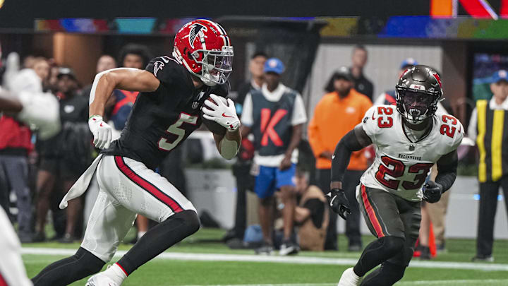 Oct 3, 2024; Atlanta, Georgia, USA; Atlanta Falcons wide receiver Drake London (5) runs past Tampa Bay Buccaneers safety Tykee Smith (23) for a touchdown during the first quarter at Mercedes-Benz Stadium. Mandatory Credit: Dale Zanine-Imagn Images