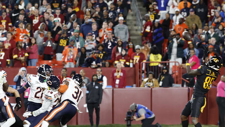 Washington Commanders wide receiver Noah Brown prepares to catch a game-winning Hail Mary pass against the Chicago Bears.