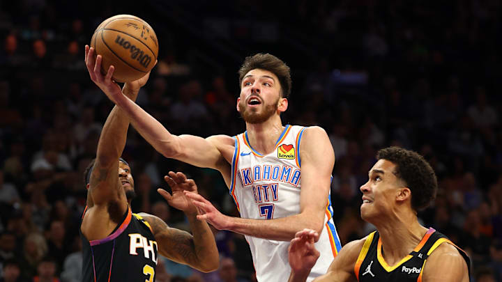 Oklahoma City Thunder forward Chet Holmgren shoots the ball over Phoenix Suns guard Bradley Beal.