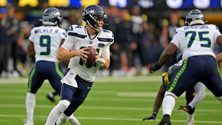 Nov 16, 2025; Inglewood, California, USA; Seattle Seahawks quarterback Sam Darnold (14) drops back to pass during the first half against the Los Angeles Rams at SoFi Stadium. 