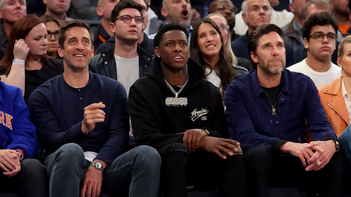 May 2, 2023; New York, New York, USA; New York Jets quarterback Aaron Rodgers (left to right) and cornerback Sauce Gardner sit next to New York Rangers former goaltender Henrik Lundqvist during the second quarter of game two of the 2023 NBA Eastern Conference semifinal playoffs between the New York Knicks and the Miami Heat at Madison Square Garden. Mandatory Credit: Brad Penner-USA TODAY Sports